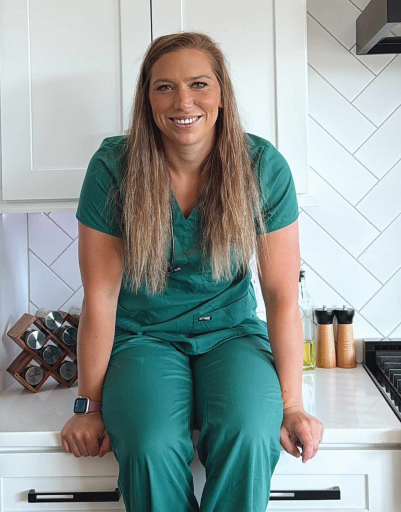 Gina Wolf pictured in green scrubs
